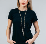 Woman wearing Grey Mala necklace